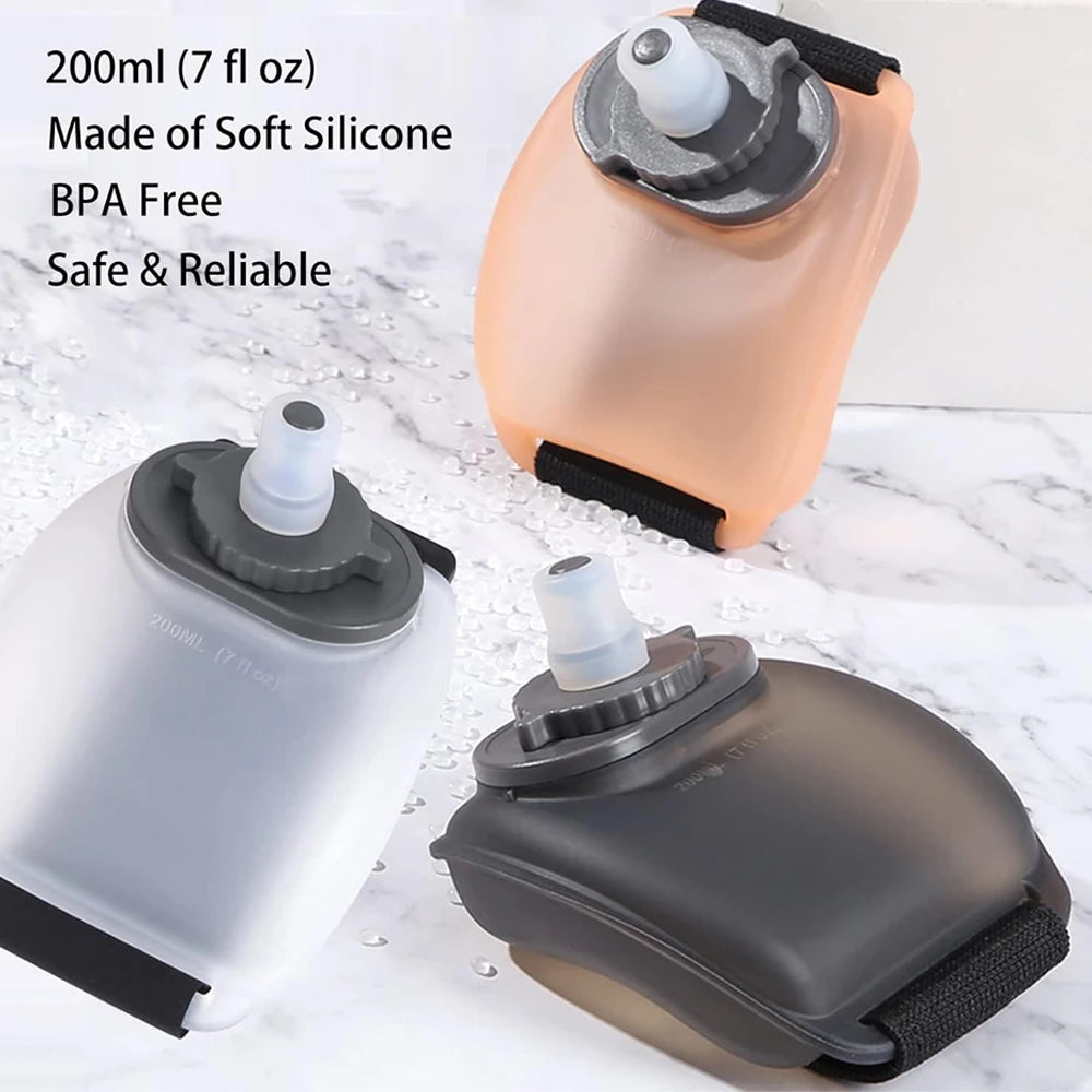 Three flexible silicone water bottles in different colors on a marble surface with text indicating volume and features.